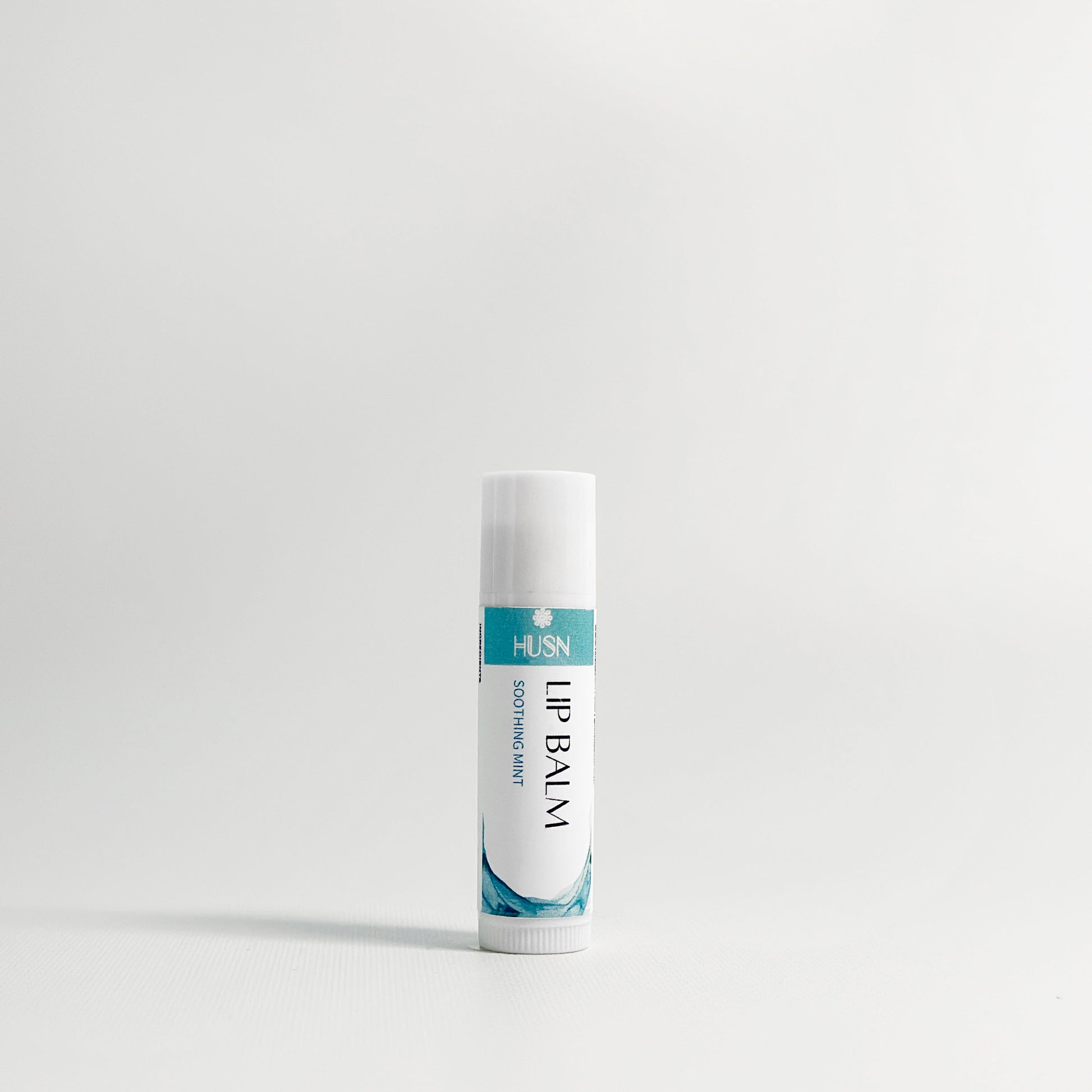 Lip balm tube on a white background